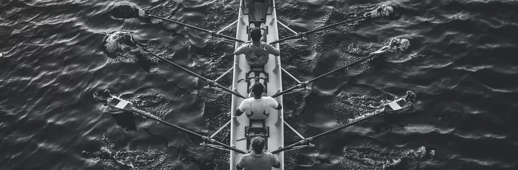 A group of people driving boat in river